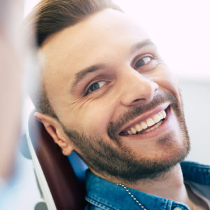 A perfect result of a dentist’s work which is seen in the beautiful and white smile on a patient who is absolutely satisfied with a result of a treatment given in a clinic.